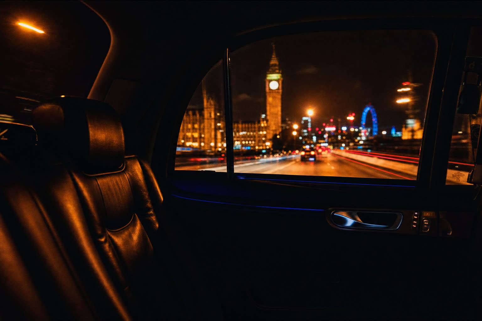 View from inside a moving V Cab at night, looking out at Westminster
